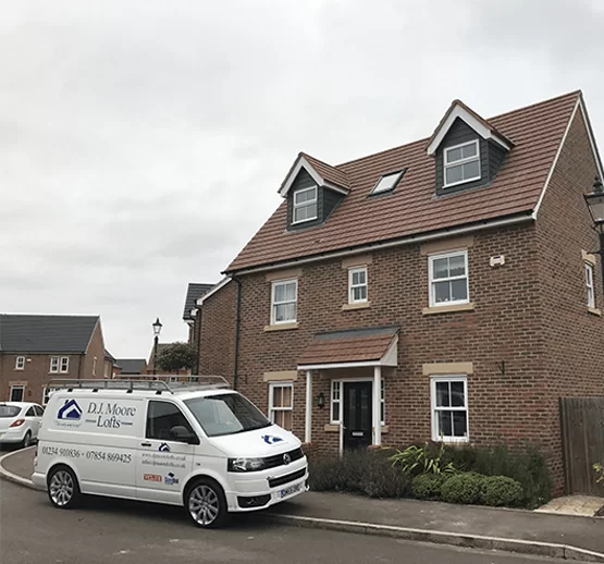 White DJ Moore Van Near House