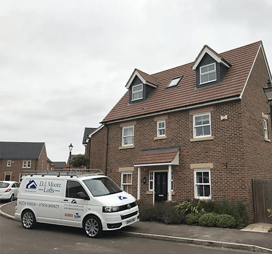 White DJMoore Van Near House