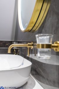 gold tap in bathroom