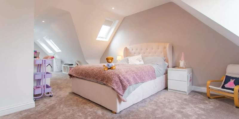 Pink dormer conversion bedroom
